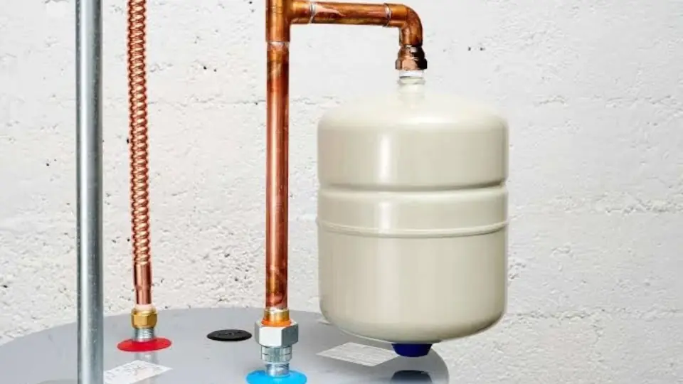 Expansion tank mounted on the copper supply line above a tank water heater